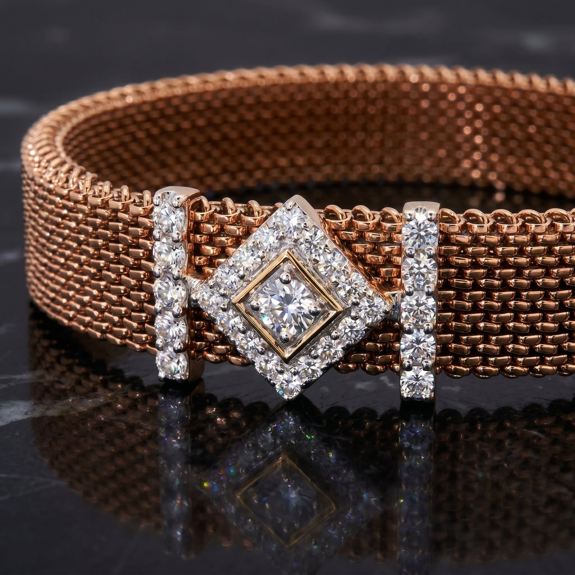 Rose gold mesh bracelet with geometric lab grown diamond motif on a reflective surface