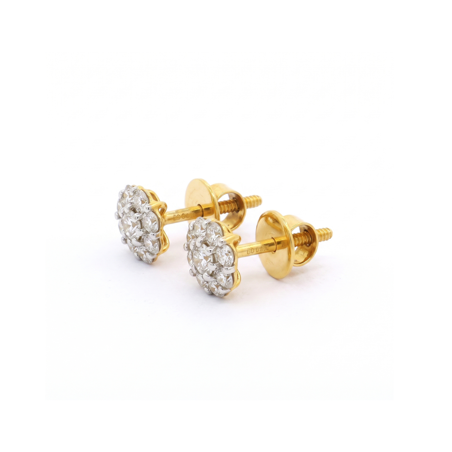Gold earrings with gemstones on a white background