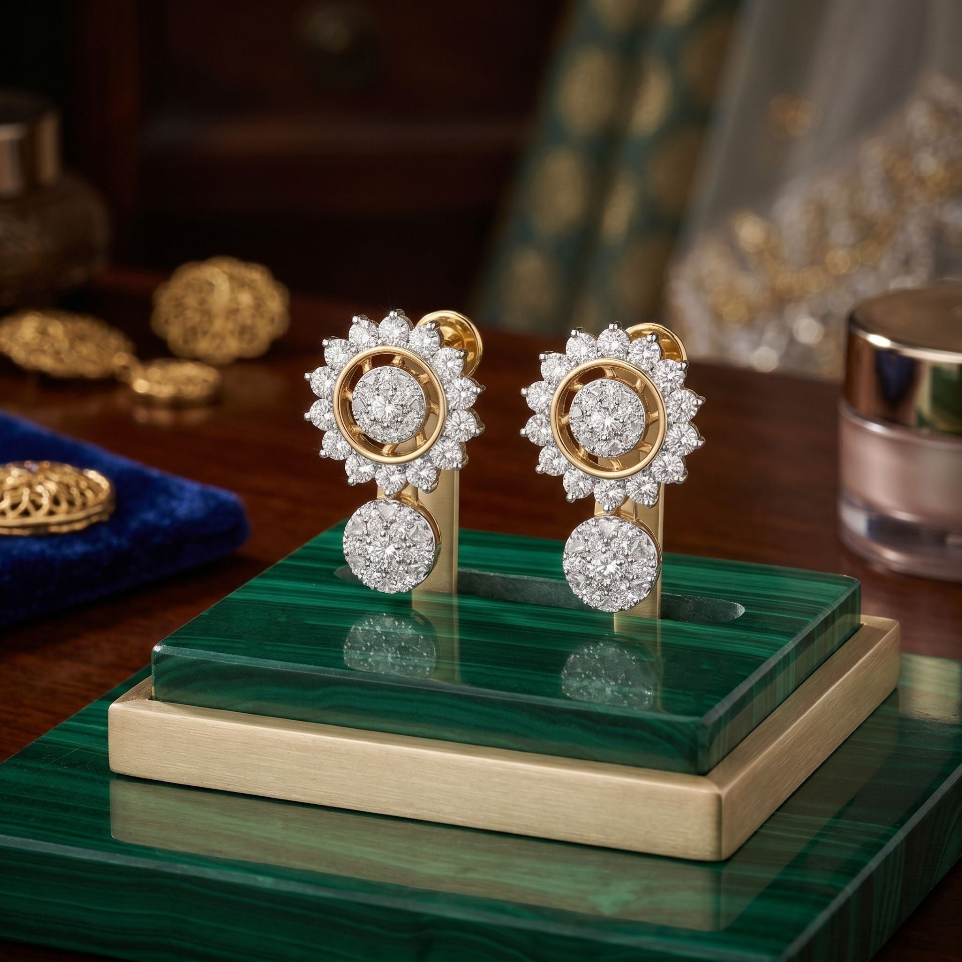 Pair of gold and diamond earrings on a green stand with a blurred background