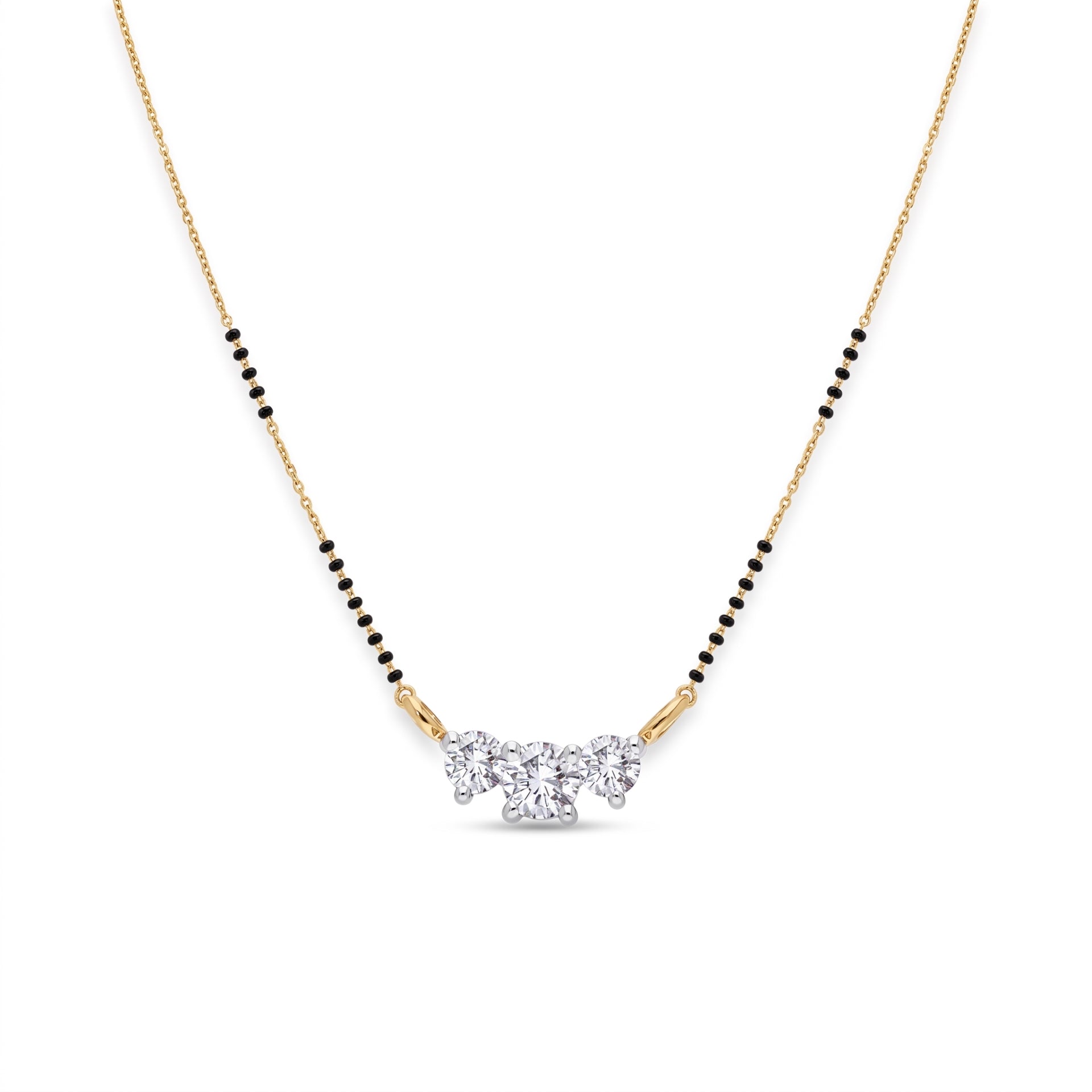 A delicate gold chain necklace with a black bead line and a central cluster of clear gemstones, shown on a plain white background.