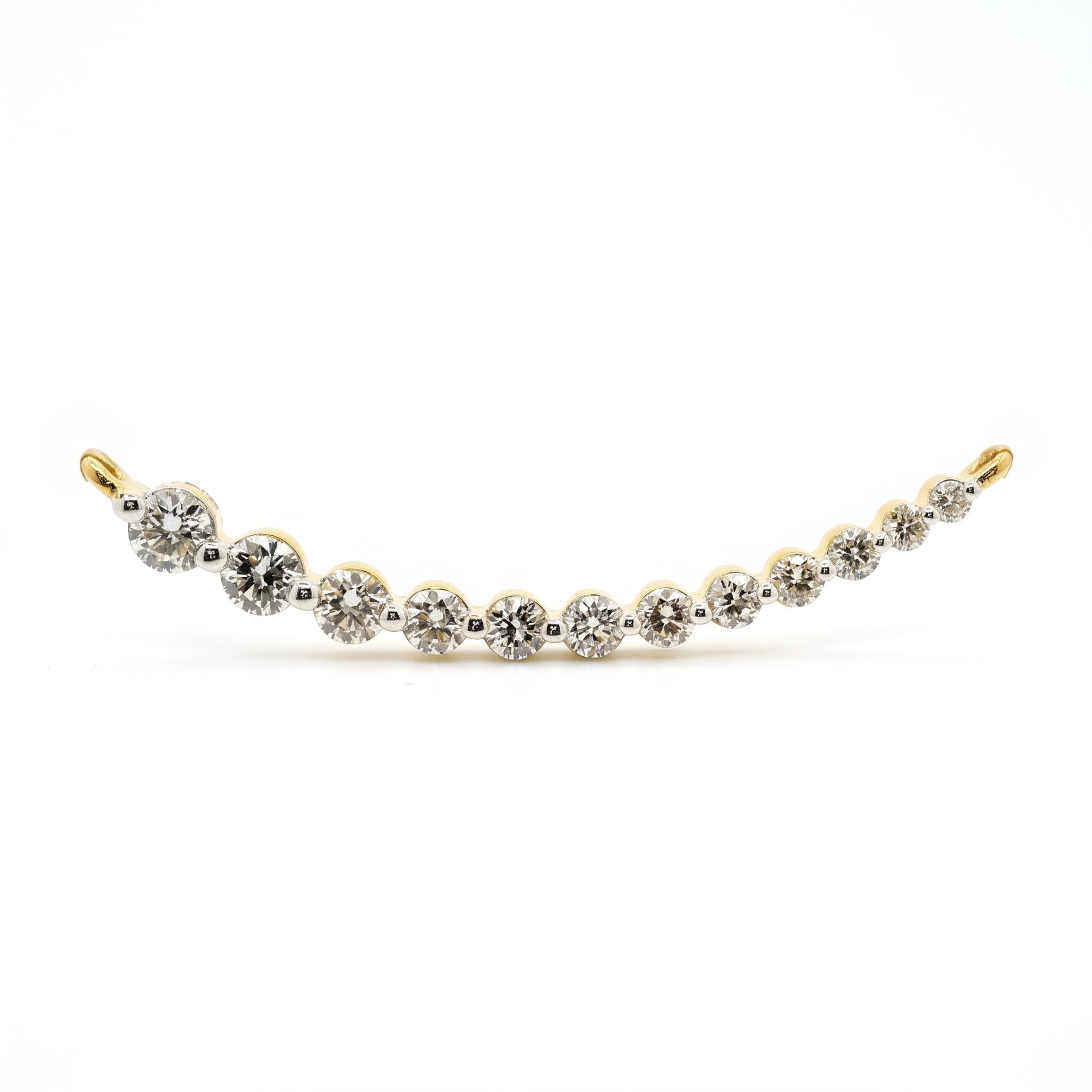 A delicate curved tennis bracelet featuring alternating round-cut clear gemstones in white metal and yellow gold settings, displayed against a solid white background.
