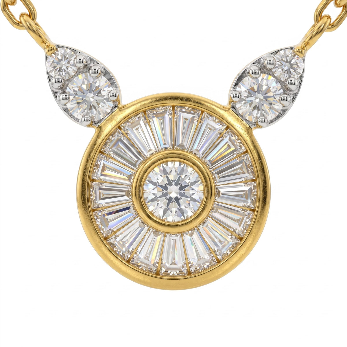 A yellow gold pendant necklace featuring a circular sunburst design with a central round diamond and baguette-cut diamonds, flanked by two teardrop-shaped diamond clusters on a white background.