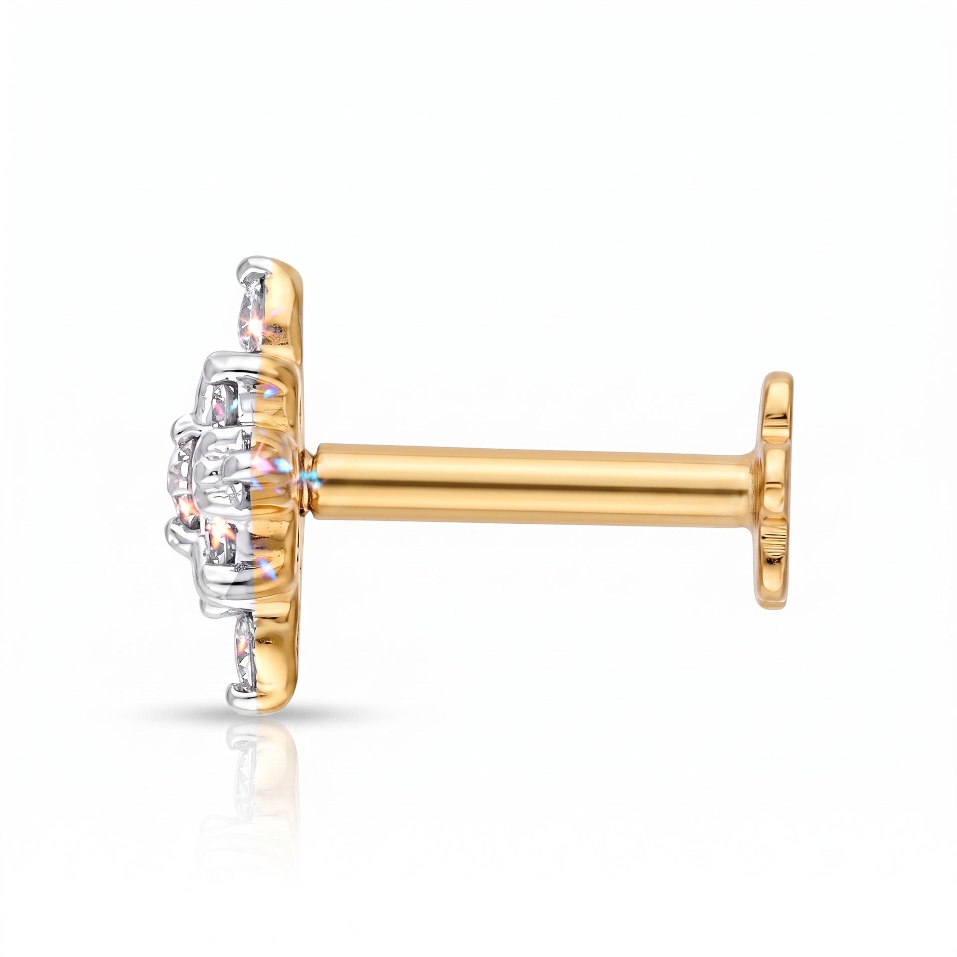 A single gold and silver stud earring with a clear gemstone cluster, shown from a side profile view on a white background.