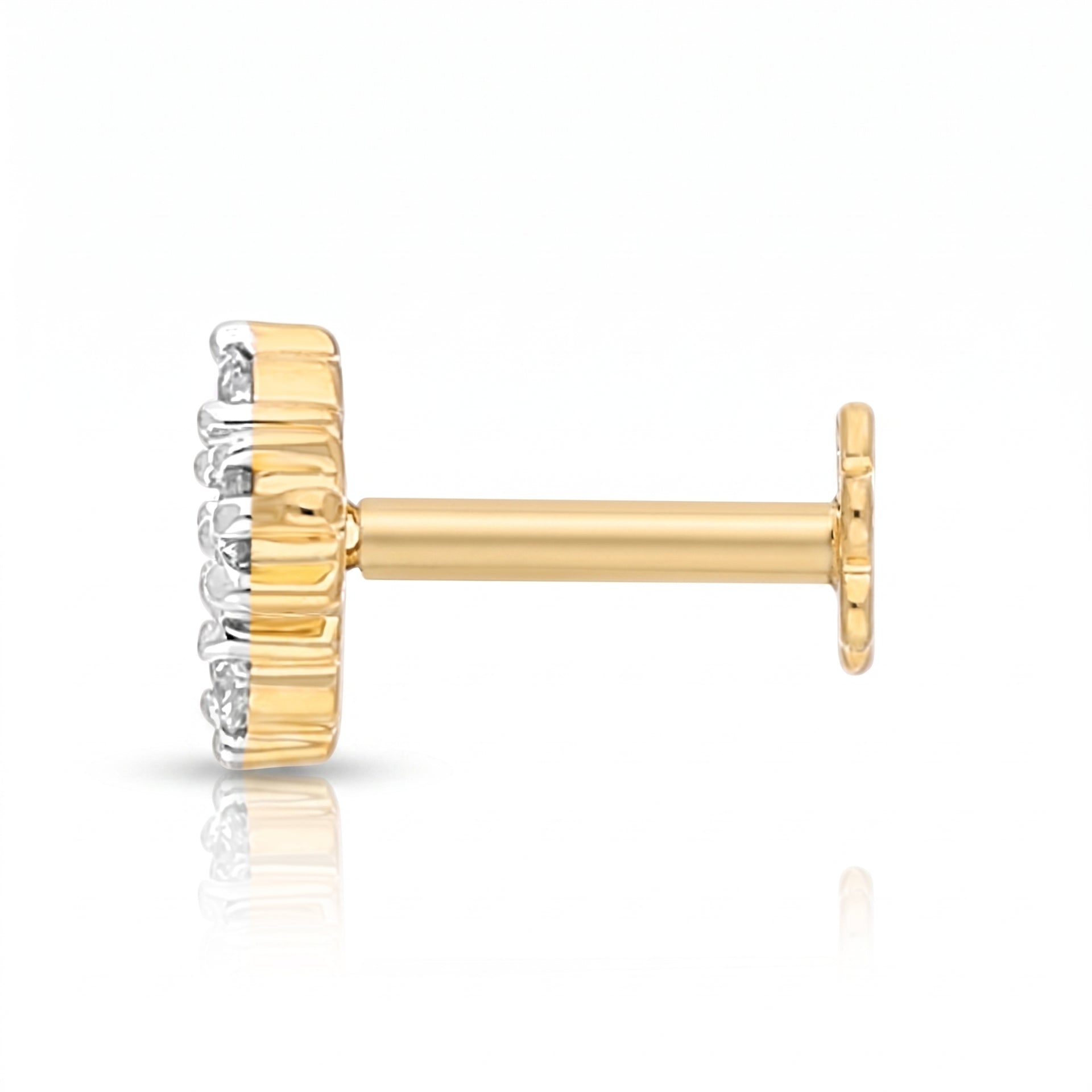 A single gold post stud earring with a textured gold crown-like setting and small clear stones on the front, shown on a white background with a soft reflection.