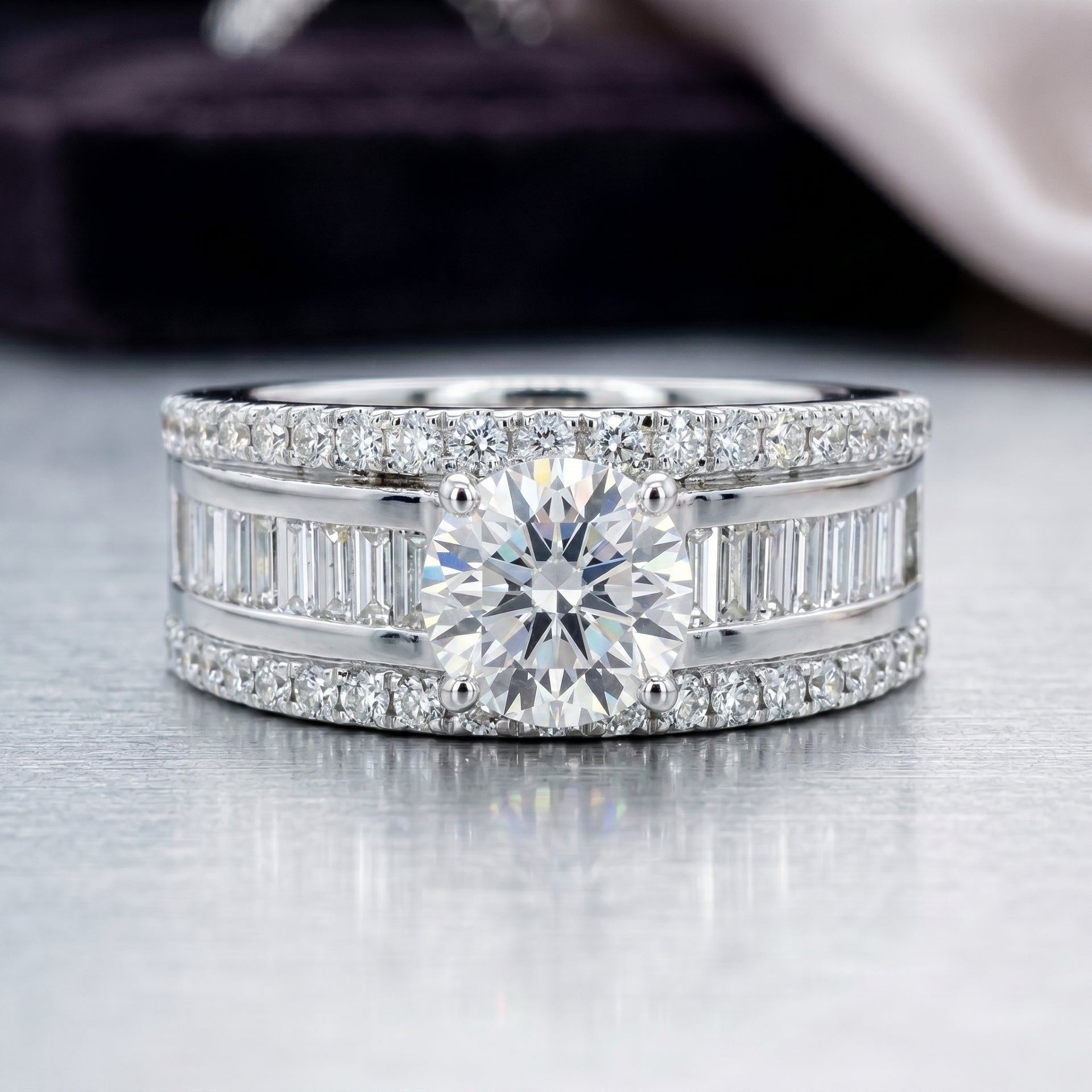 Diamond ring with a large central gemstone and smaller diamonds on a reflective surface