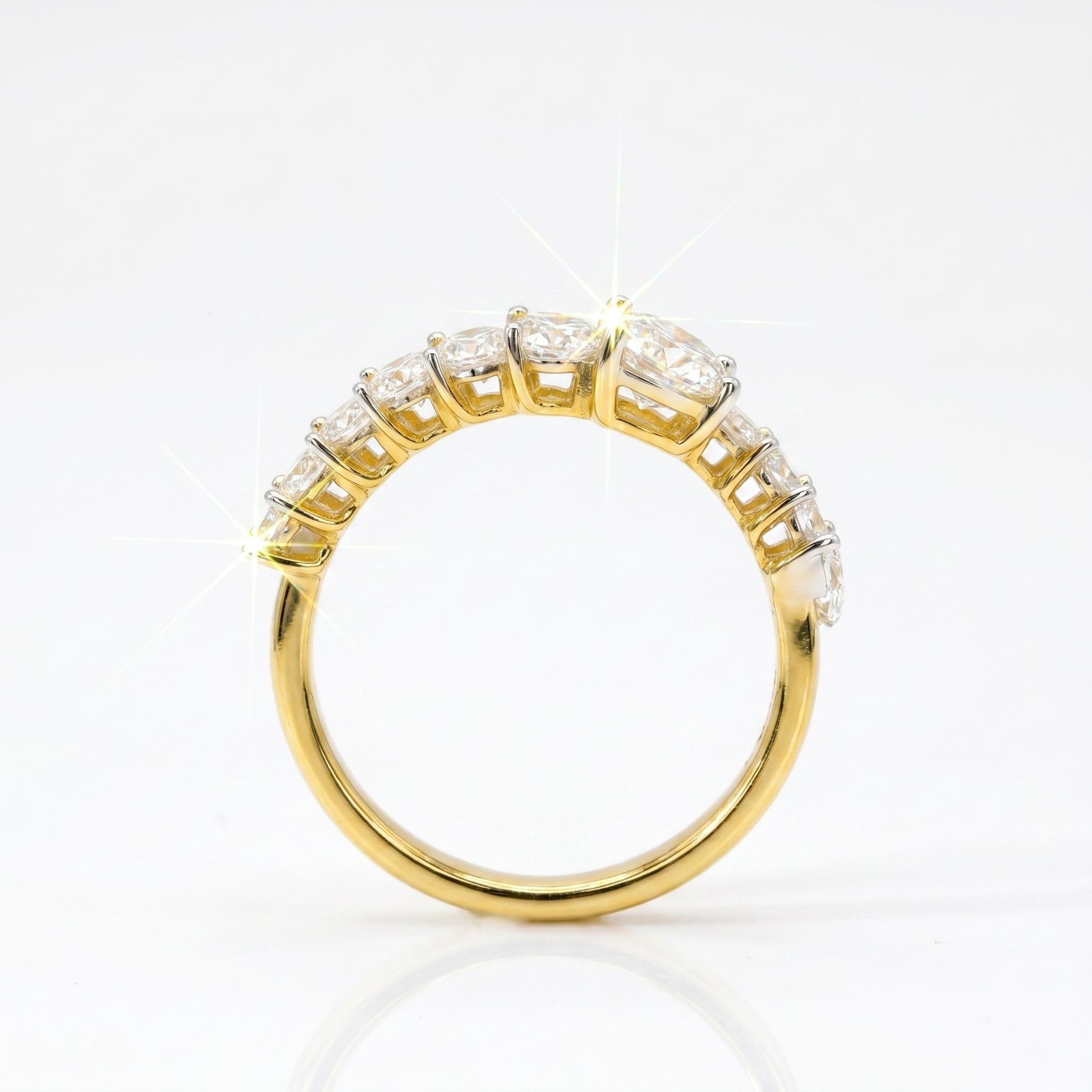 Gold ring with diamonds on a white background