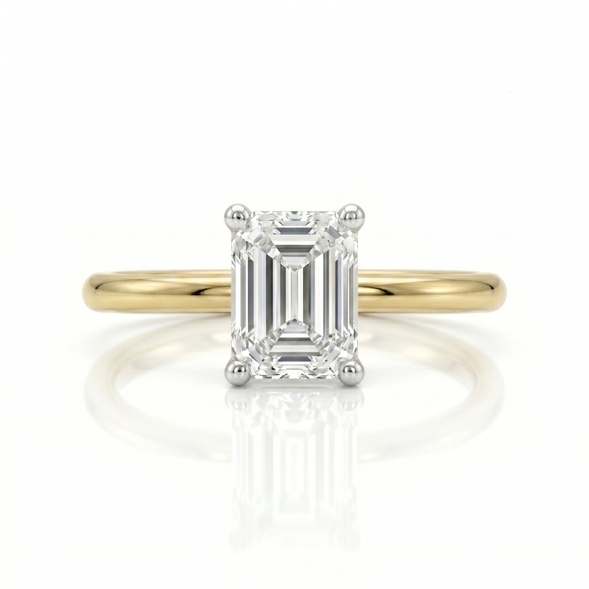 Gold ring with a diamond on a white background