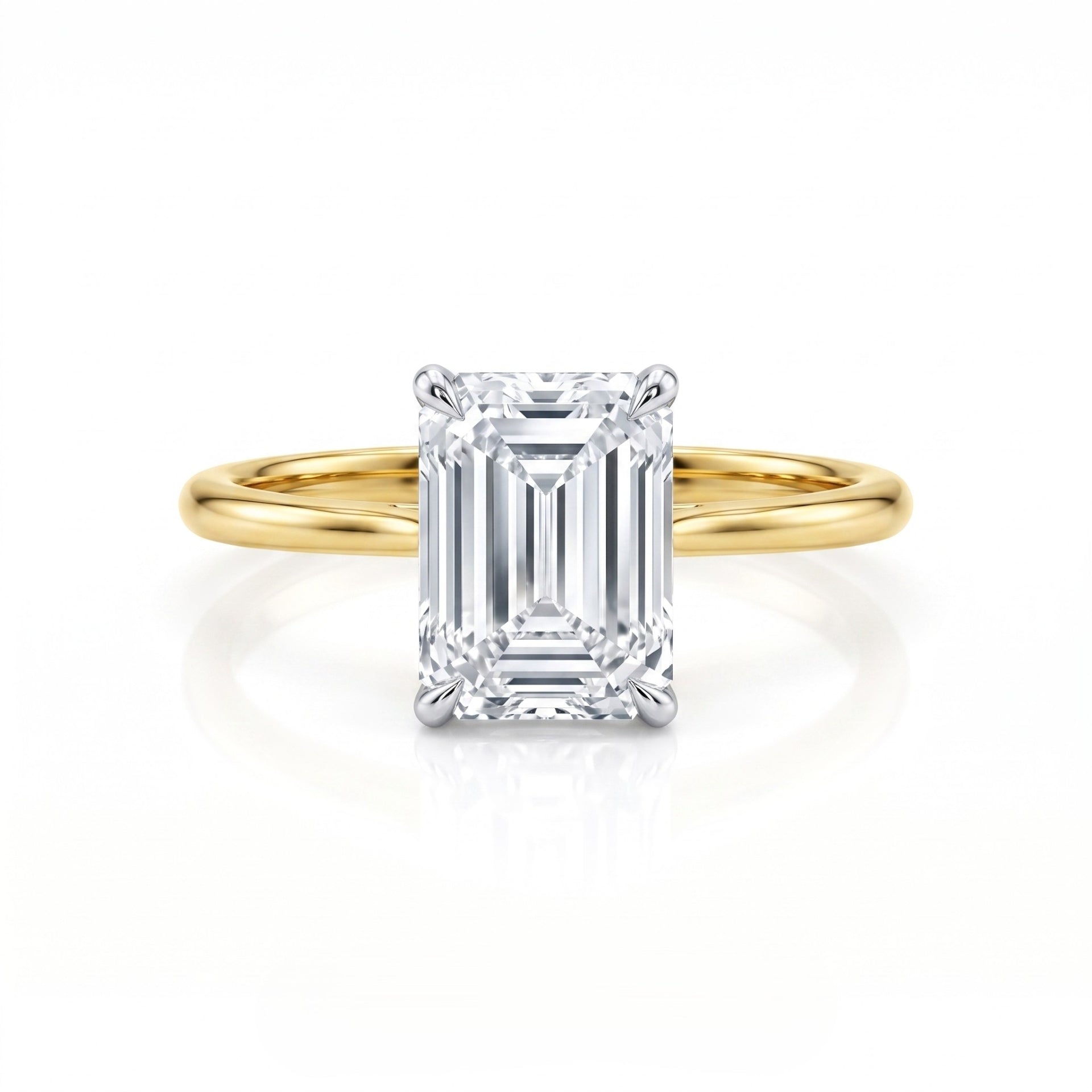 Gold ring with a large diamond on a white background