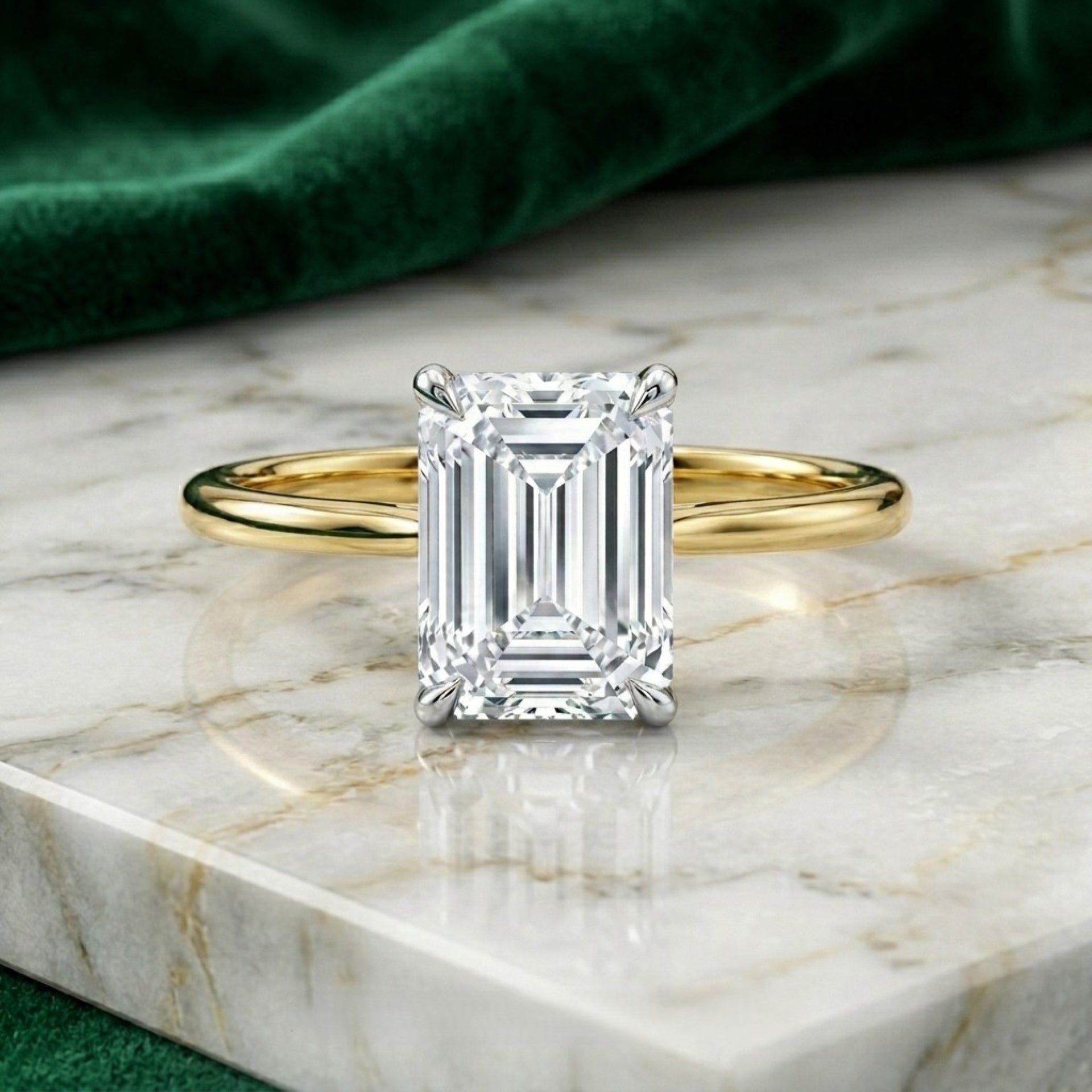 Gold ring with a large diamond on a marble surface