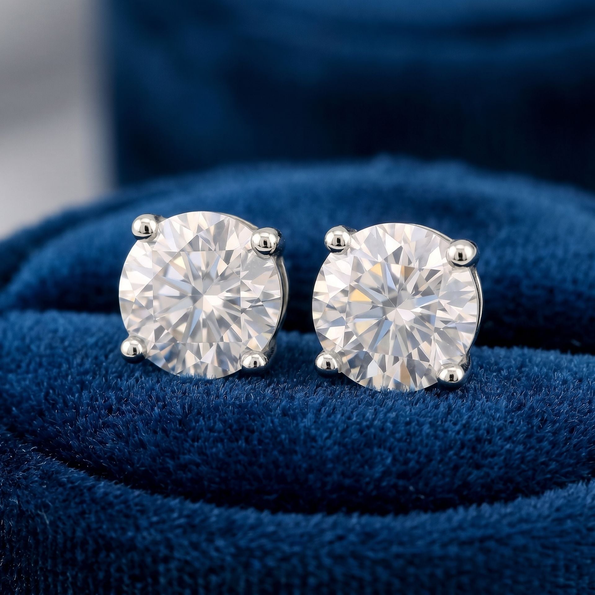 Round cluster lab grown diamond stud earrings on blue velvet