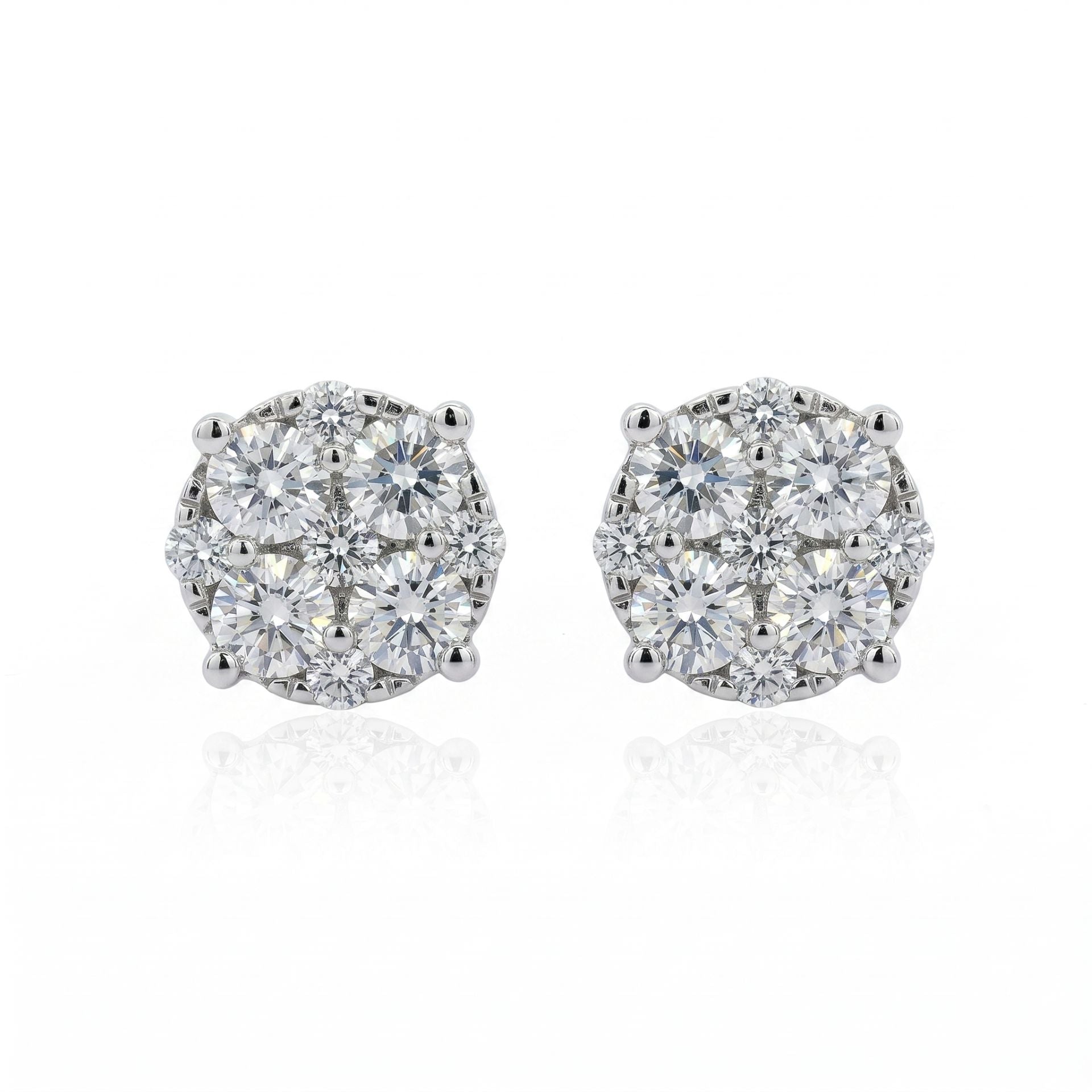 Pair of diamond stud earrings on a white background