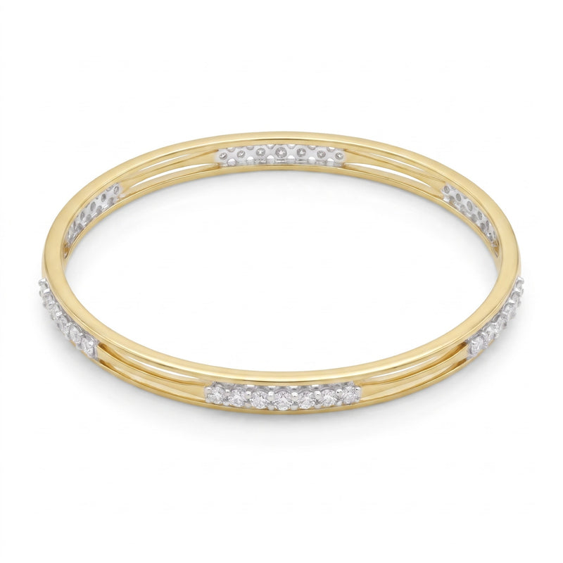 A yellow gold triple-band bangle bracelet with rows of small clear pavé stones set along the outer bands, shown on a plain white background.
