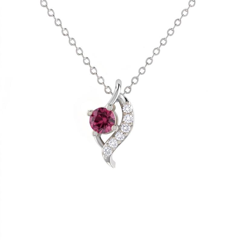 A silver pendant necklace featuring a round pinkish-red gemstone and a curved silver setting with small clear stones, shown on a white background.
