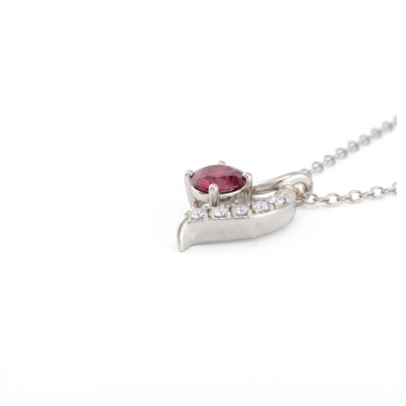 A silver pendant necklace featuring a marquise-cut pink gemstone accented by small clear stones along the curve, suspended from a silver ball chain on a white background.