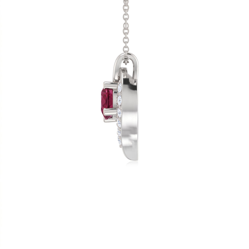 A silver pendant necklace featuring a rectangular ruby gemstone and a halo of small clear stones, shown from a side profile view against a white background.