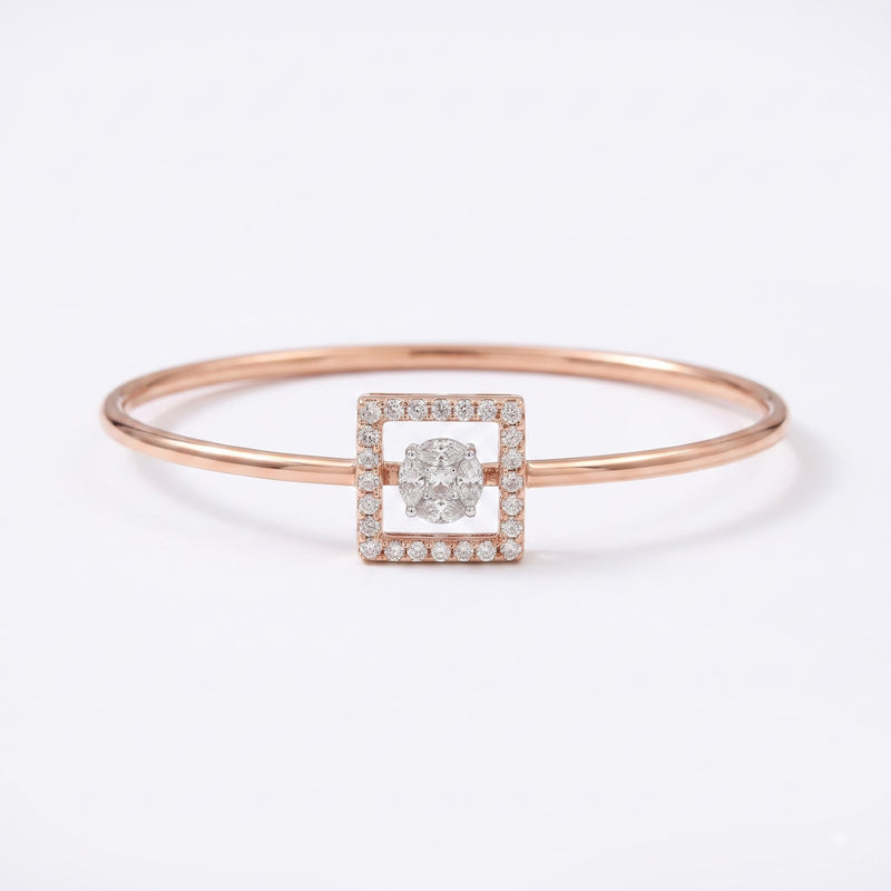 A rose gold bangle bracelet featuring a square-shaped centerpiece with a central round diamond surrounded by a halo of small pavé diamonds, set against a clean white background.
