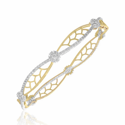Gold and silver bracelet with intricate design on a white background