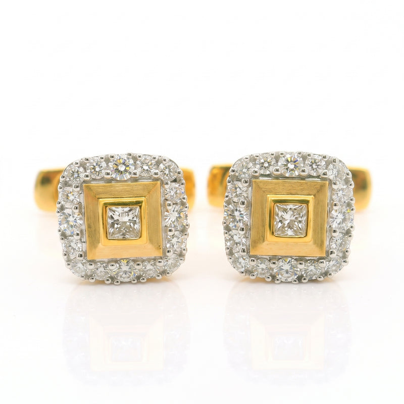 Gold square shaped cufflinks with diamonds studded in centre and on the boundary. 