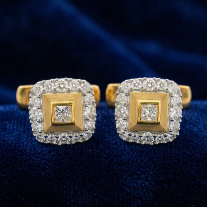 Gold square shaped cufflinks with diamonds studded in centre and on the boundary. 