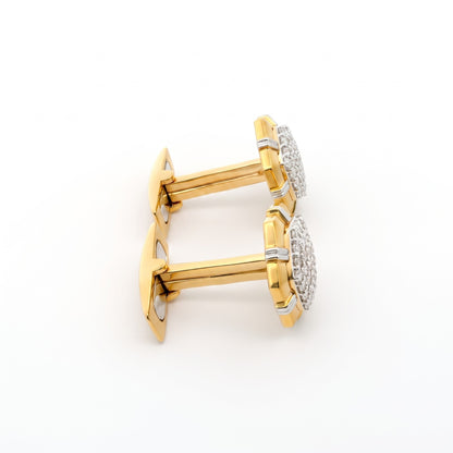 A pair of gold cufflinks with round pavé-set clear stones, photographed on a clean white background.