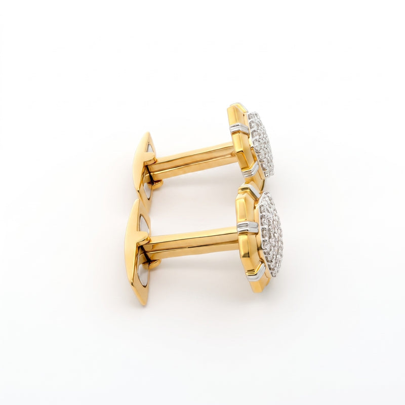 A pair of gold cufflinks with round pavé-set clear stones, photographed on a clean white background.