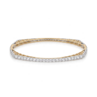 A yellow gold bangle bracelet featuring a continuous row of pavé-set round diamonds on the outer band, with an openwork filigree gold inner band, shown against a plain white background.