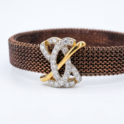 Brown woven belt with a gold and silver interlocking ring buckle on a white background.