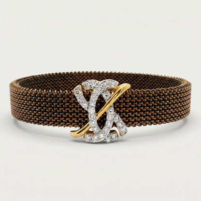 Brown woven bracelet with a gold and silver clasp on a light gray background.