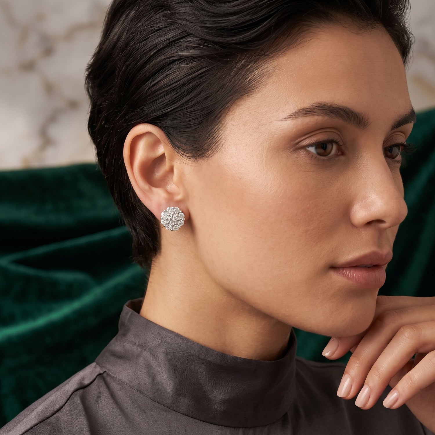 Woman wearing a diamond earring with a blurred background