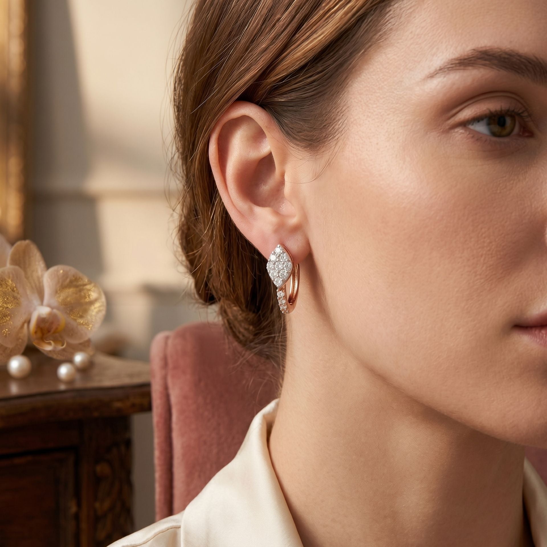 Close-up of a woman wearing a diamond earring with a blurred background
