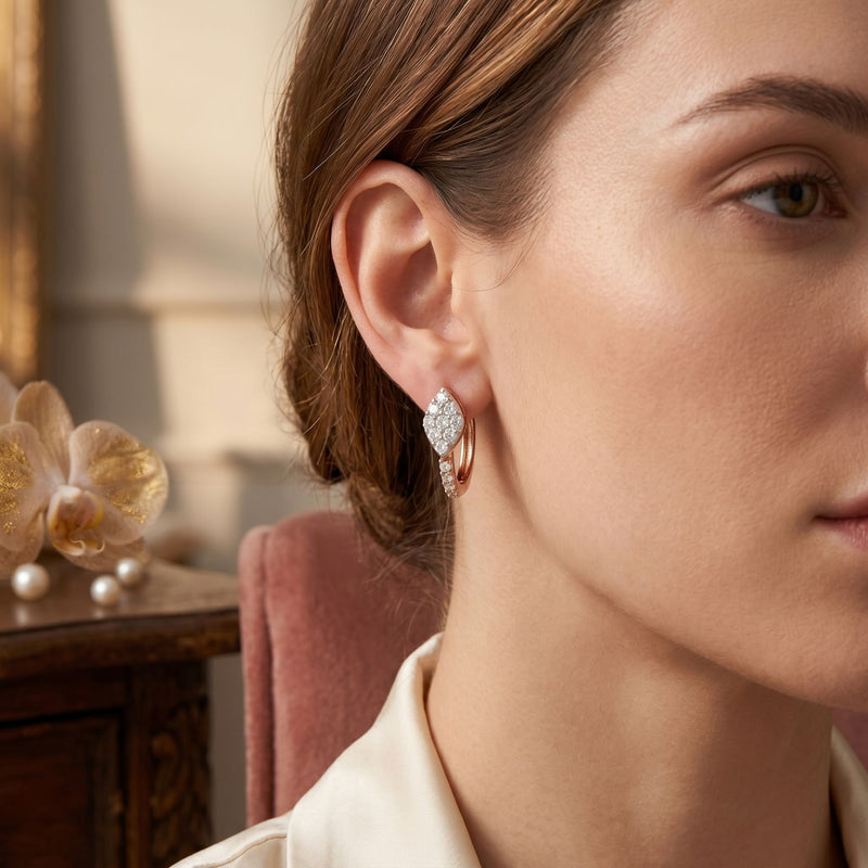 Close-up of a woman wearing a diamond earring with a blurred background