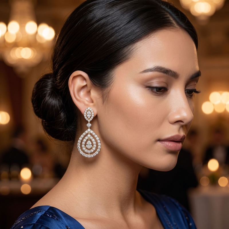 Woman wearing elegant diamond earrings with a blurred background