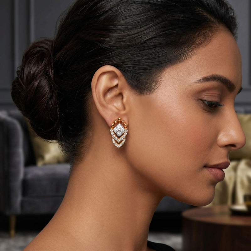 Woman wearing elegant lab-grown diamond drop earrings in a side profile.