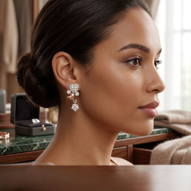 Woman wearing elegant earrings with a jewelry box in the background