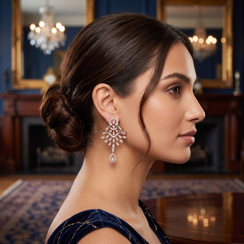 Woman wearing elegant earrings in a luxurious room with chandeliers.