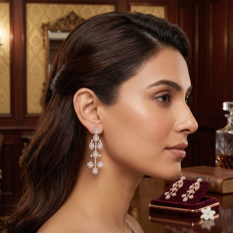 Woman wearing elegant geometric lab-grown diamond stud earrings in a luxury indoor portrait.