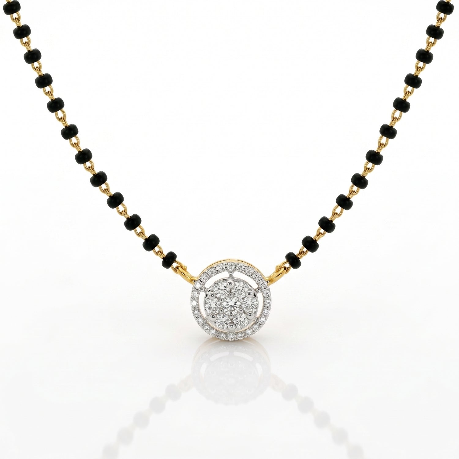A gold and black beaded necklace with a round pendant featuring a halo of small clear stones, shown on a white background with a soft reflection.