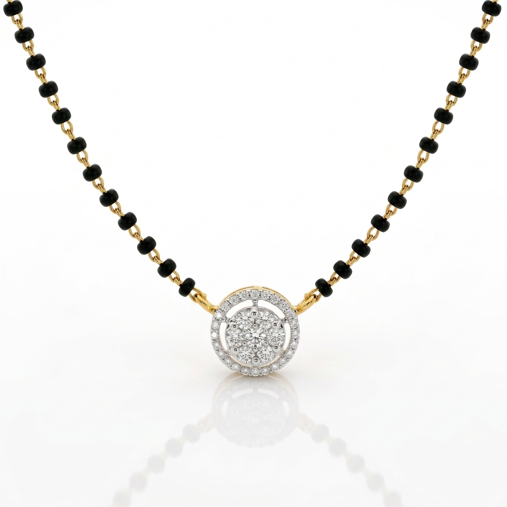 A gold and black beaded necklace with a round pendant featuring a halo of small clear stones, shown on a white background with a soft reflection.