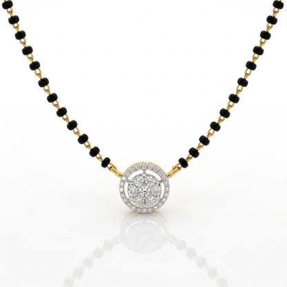 A gold and black beaded necklace with a round pendant featuring a halo of small clear stones, shown on a white background with a soft reflection.
