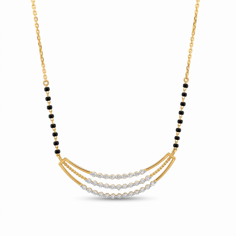 A gold necklace with a curved triple-row diamond pendant, accented by rows of small black beads along the chain, shown on a clean white background.