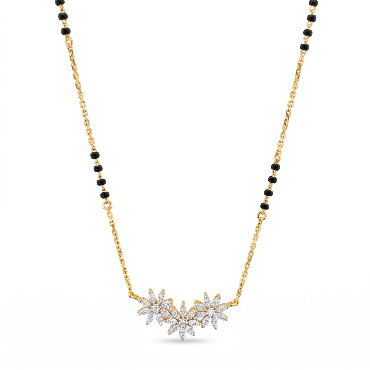 A gold chain necklace with a black bead accent and a central cluster of three flower pendants set with clear stones, shown on a plain white background.