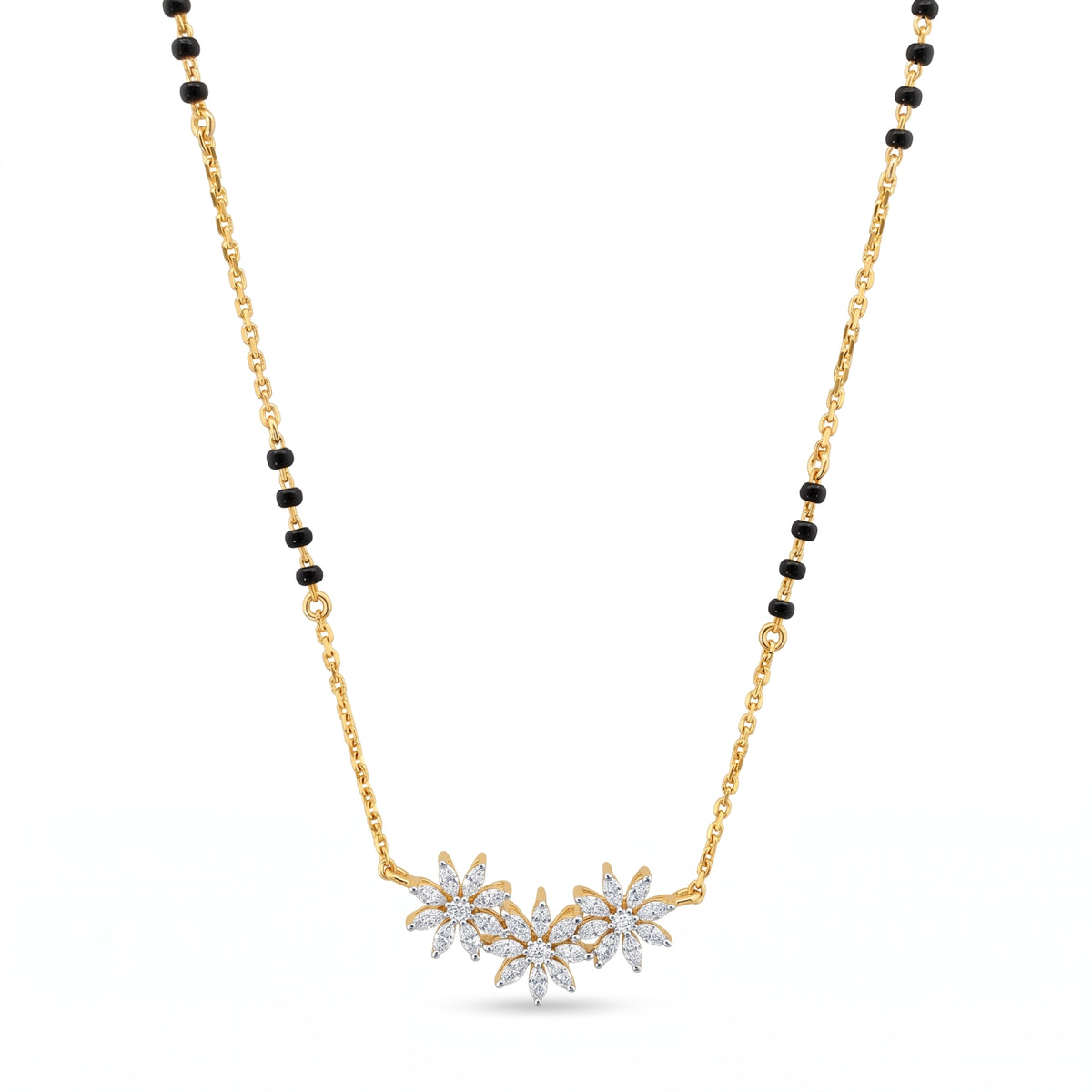 A gold chain necklace with a black bead accent and a central cluster of three flower pendants set with clear stones, shown on a plain white background.