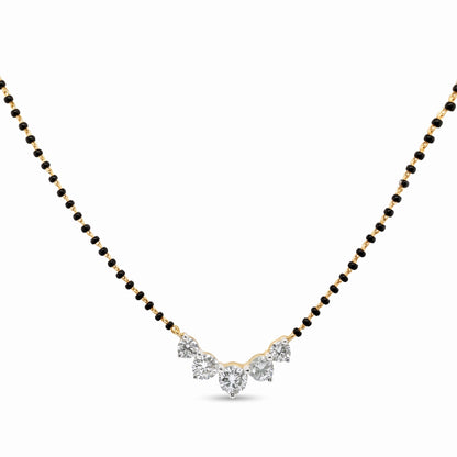 A yellow gold and black bead chain necklace with a V-shaped pendant featuring clear gemstones, shown on a plain white background.