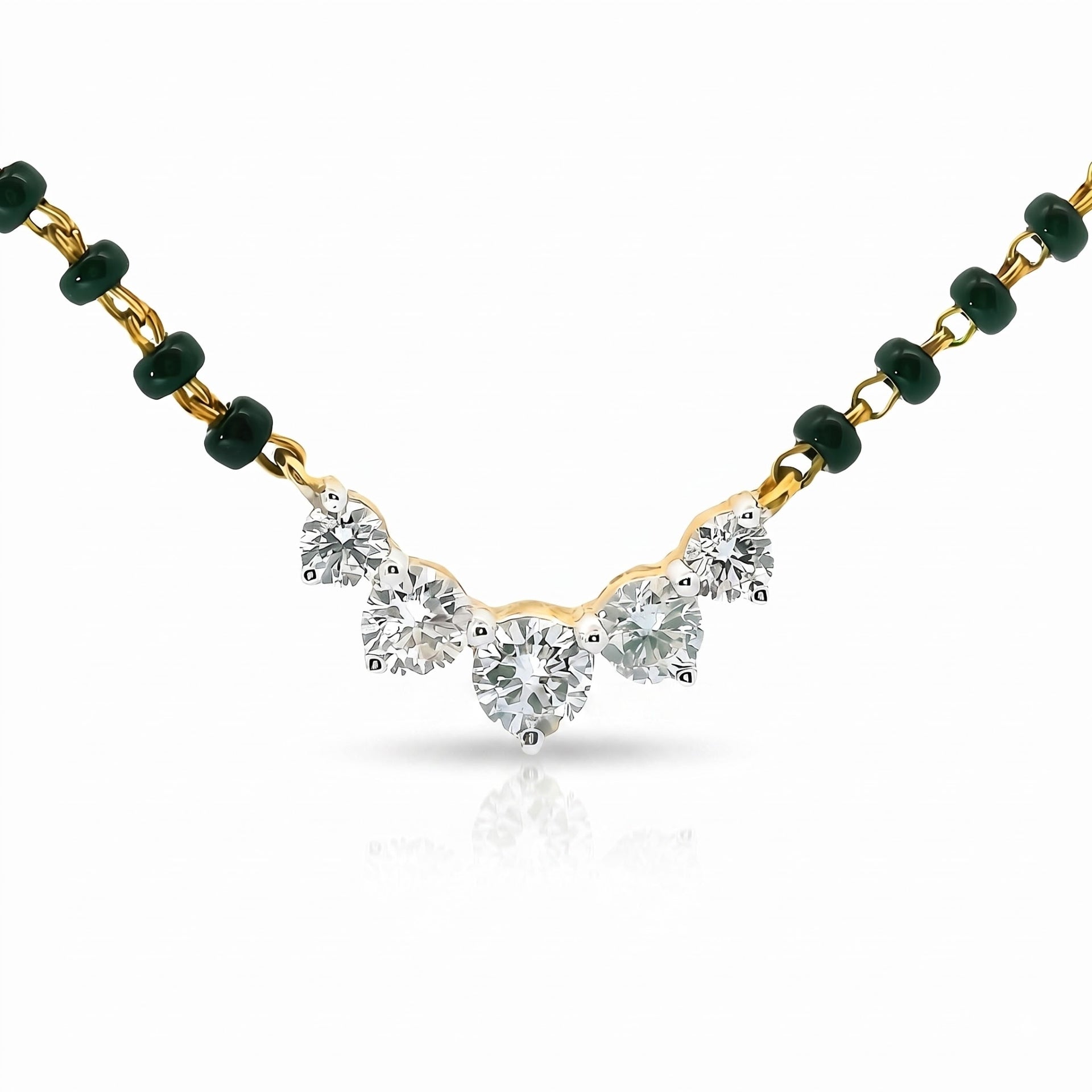 A delicate necklace featuring a central cluster of five clear heart-shaped gemstones in a gold setting, suspended from a chain accented with dark green beads on both sides, set against a clean white background.