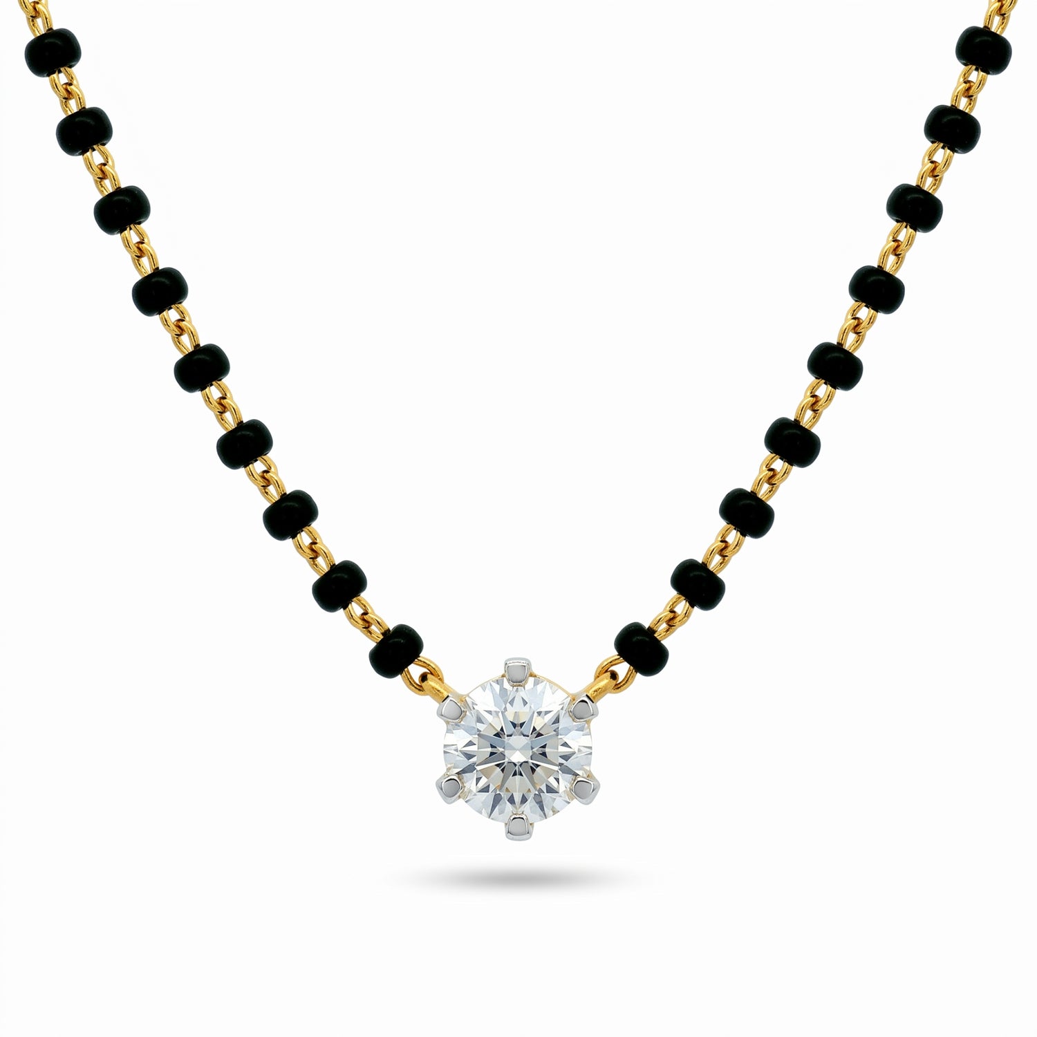 A gold and black beaded necklace with a single round-cut clear gemstone pendant, displayed on a clean white background.