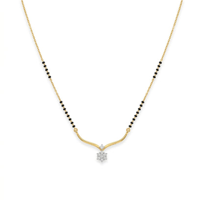 A delicate gold chain necklace featuring a black bead line on either side of a curved gold pendant, with a small clear gemstone at the center holding a star-shaped setting, shown against a plain white background.
