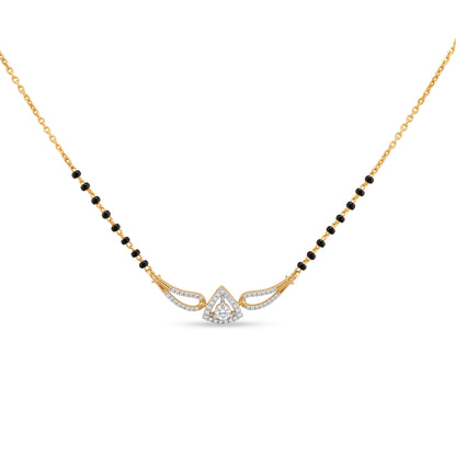 A gold chain necklace featuring a black bead-mannequin style design with a central gold and silver-toned winged pendant set with small clear stones, shown on a plain white background.