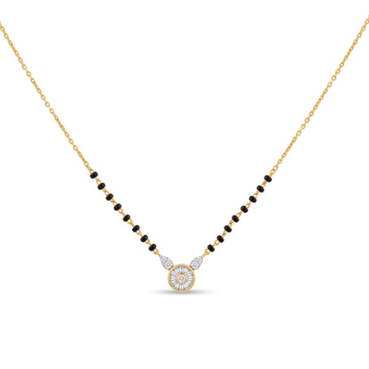 A delicate gold chain necklace featuring a central circular pendant with a halo of small clear stones, flanked by small black beads on each side of the chain, set against a plain white background.