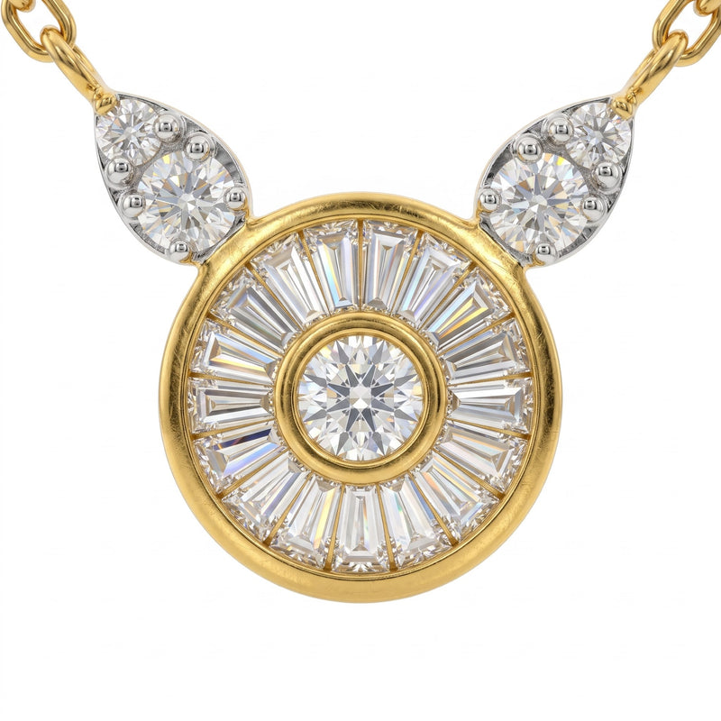 A yellow gold pendant necklace featuring a circular sunburst design with a central round diamond and baguette-cut diamonds, flanked by two teardrop-shaped diamond clusters on a white background.