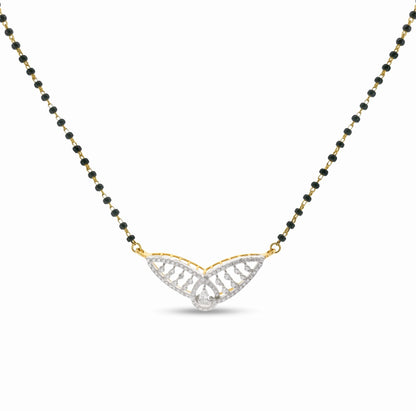 A delicate necklace featuring a black and gold beaded chain with a central wing-shaped pendant. The pendant is paved with clear stones and has a small clear teardrop at the center, suspended from gold-toned loops on a white background.